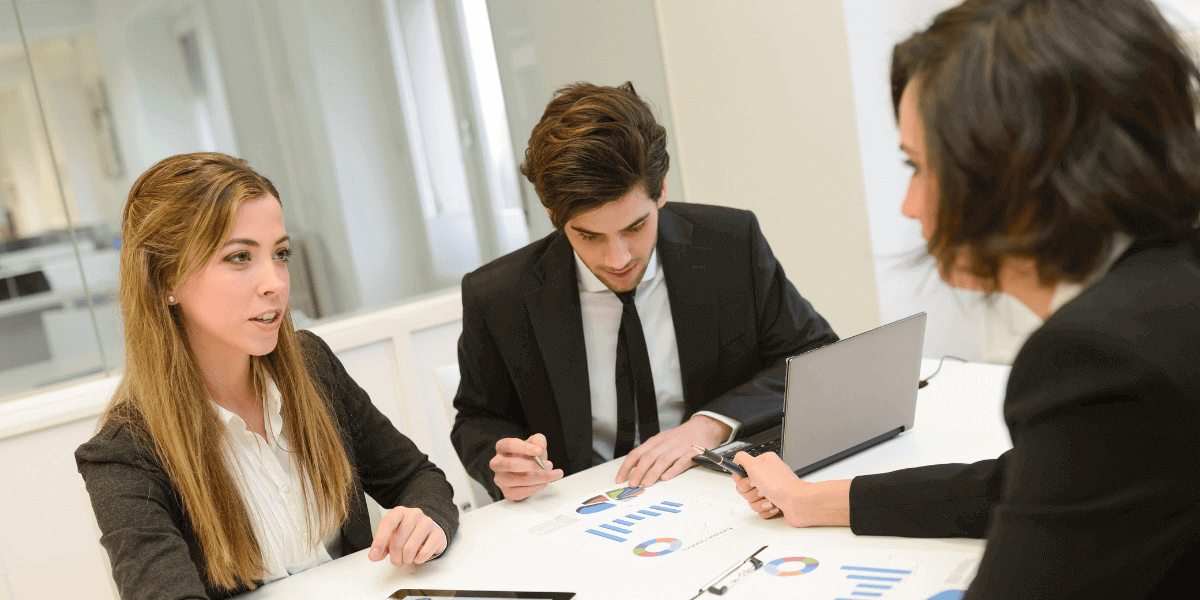 inancial advisors are having a discussion about strategies and client portfolio planning.